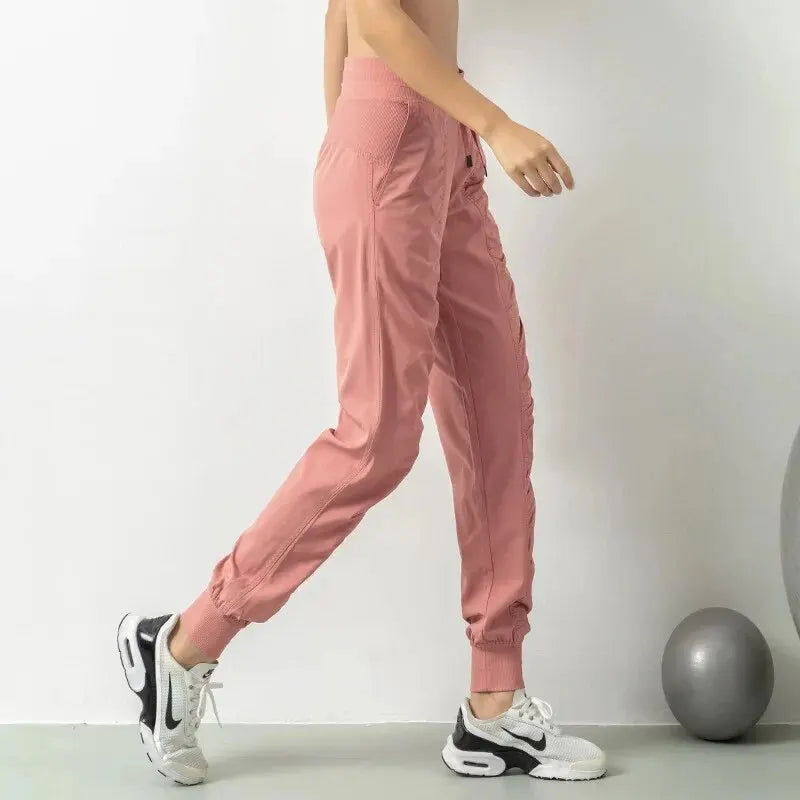 Pantalones deportivos de secado rápido para mujer con dos bolsillos laterales