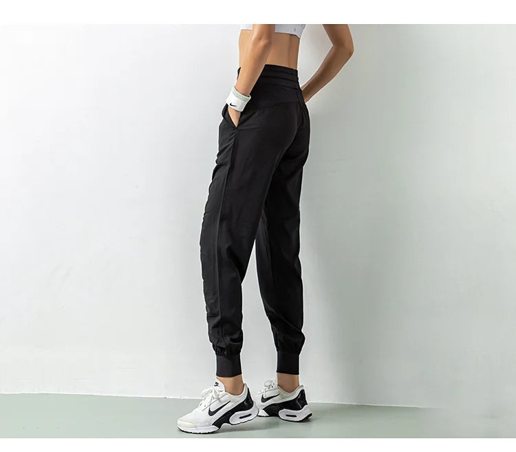 Pantalones deportivos de secado rápido para mujer con dos bolsillos laterales