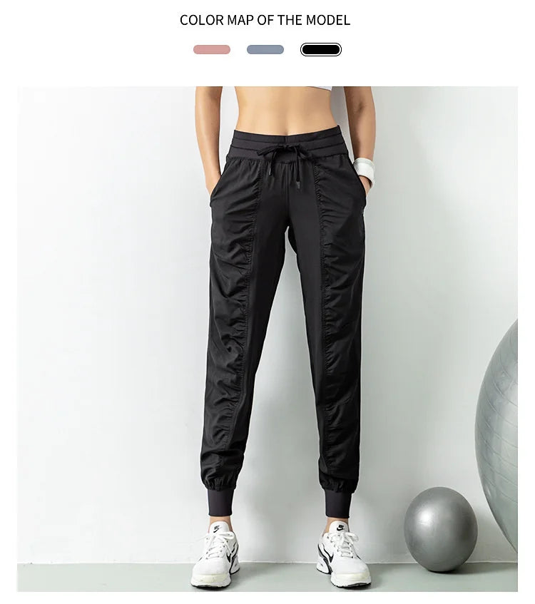 Pantalones deportivos de secado rápido para mujer con dos bolsillos laterales