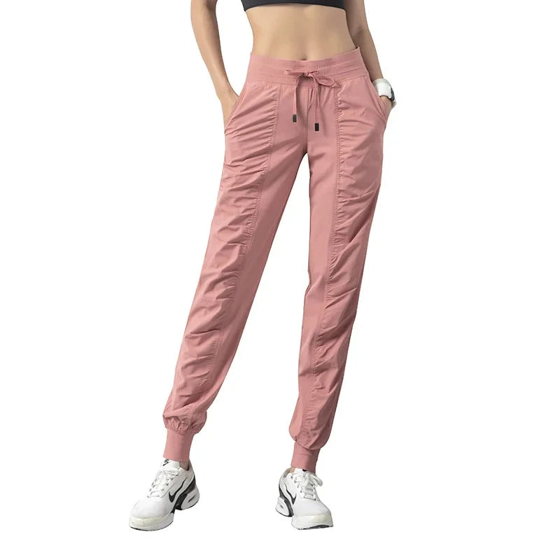 Pantalones deportivos de secado rápido para mujer con dos bolsillos laterales