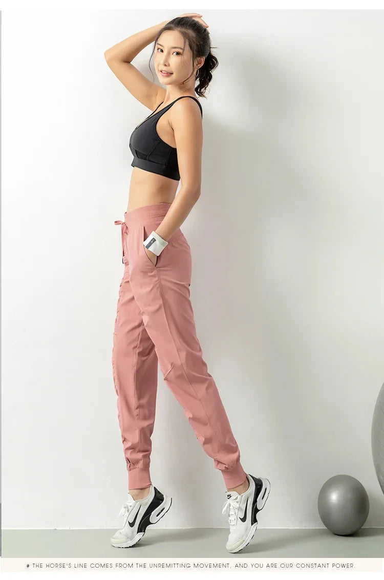 Pantalones deportivos de secado rápido para mujer con dos bolsillos laterales