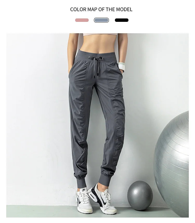 Pantalones deportivos de secado rápido para mujer con dos bolsillos laterales