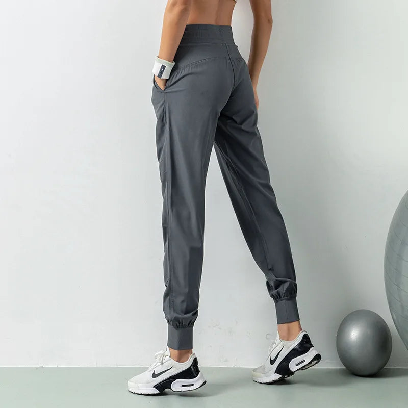 Pantalones deportivos de secado rápido para mujer con dos bolsillos laterales